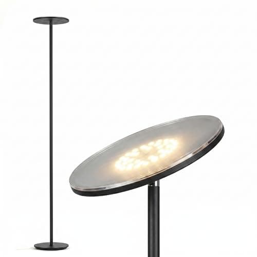 A table lamp casting warm light on a side table