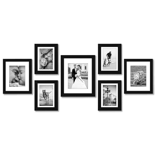 A gallery wall of framed art above a sofa