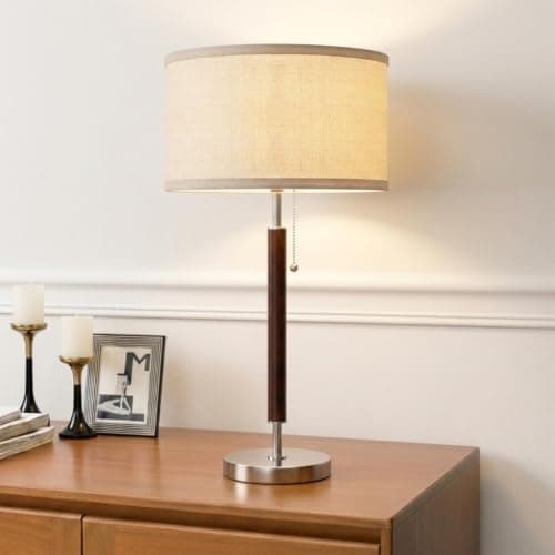 A table lamp casting warm light on a side table