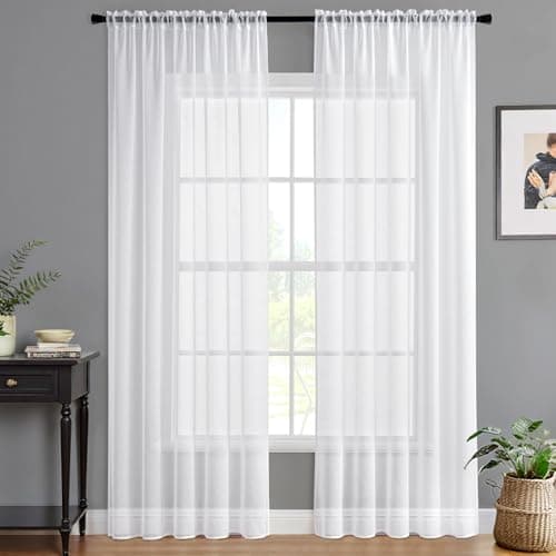 Linen curtains framing a sunlit window