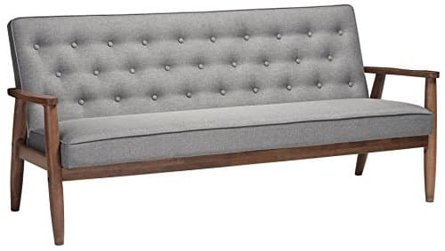 A modern sofa in a warm neutral living room
