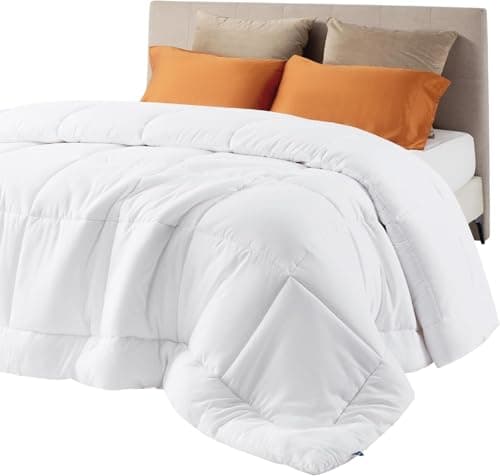 A made bed with layered linens in a cozy bedroom