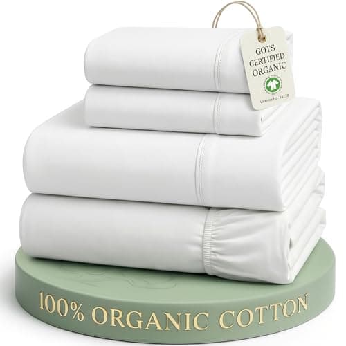 A made bed with layered linens in a cozy bedroom