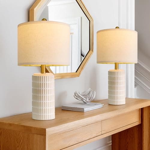 A table lamp casting warm light on a side table
