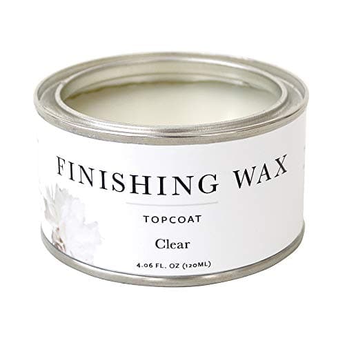 Painting a dresser with a brush during a DIY project
