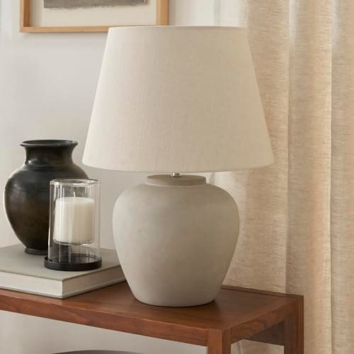 A table lamp casting warm light on a side table