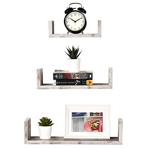 A styled shelf with vases, books, and ceramics