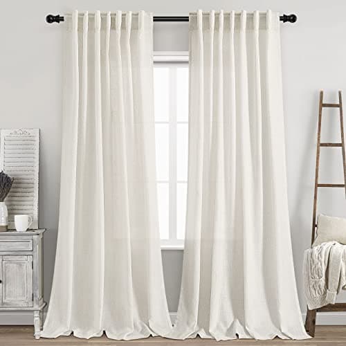 Linen curtains framing a sunlit window