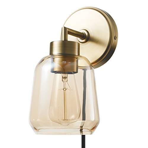 A table lamp casting warm light on a side table