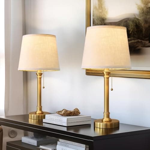 A table lamp casting warm light on a side table