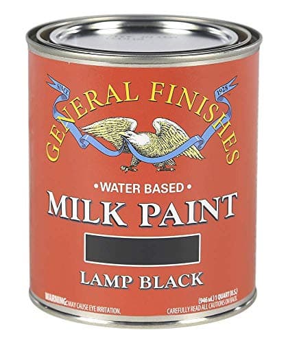 Painting a dresser with a brush during a DIY project
