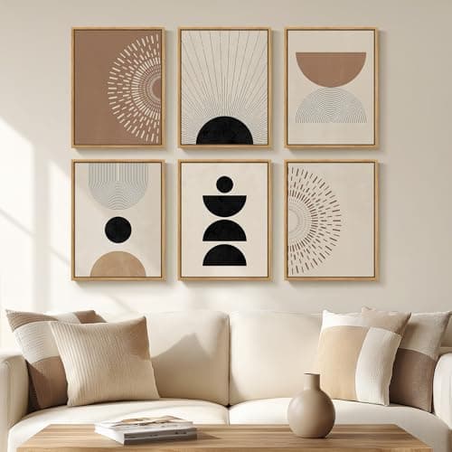 A gallery wall of framed art above a sofa