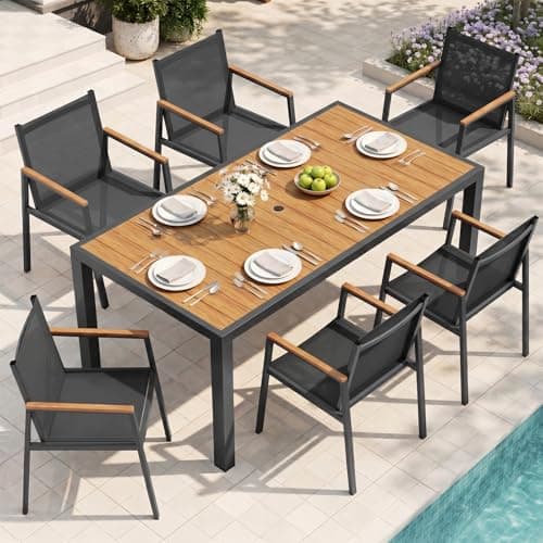 A dining table and chairs in a warm interior