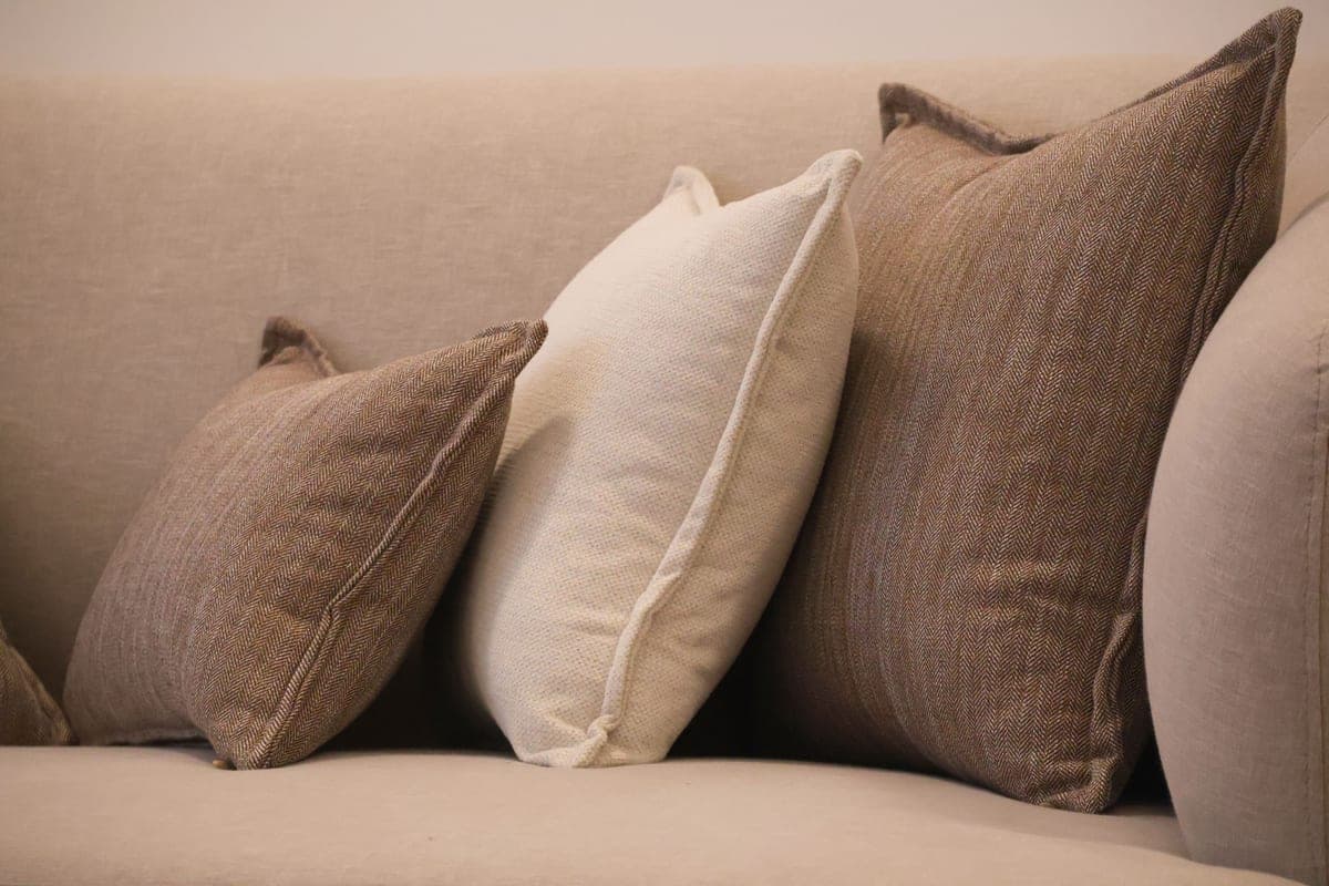 Textured throw pillows arranged on a sofa