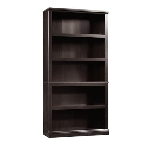A styled bookshelf with books and decor