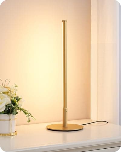 A table lamp casting warm light on a side table