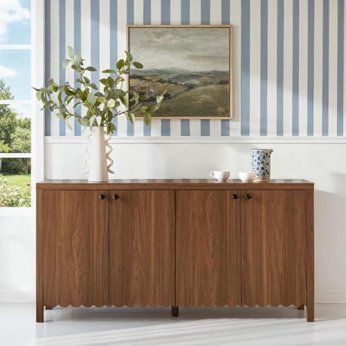 An entryway console table with decor and a mirror