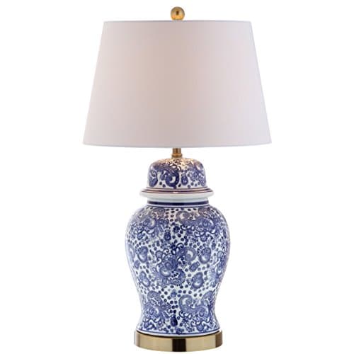 A table lamp casting warm light on a side table