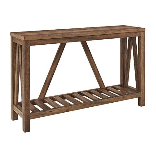 An entryway console table with decor and a mirror