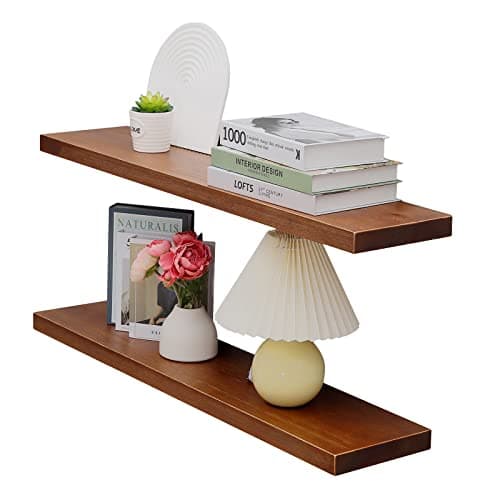 A styled shelf with vases, books, and ceramics
