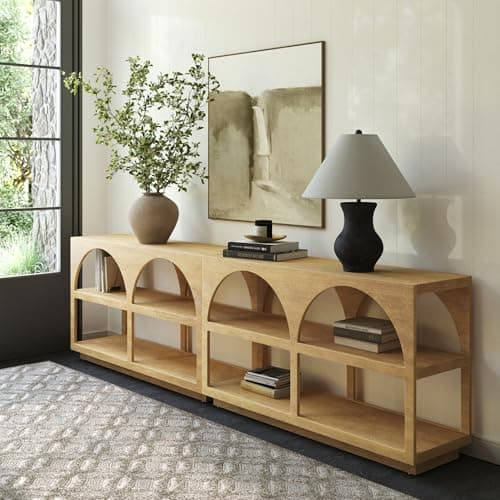 An entryway console table with decor and a mirror