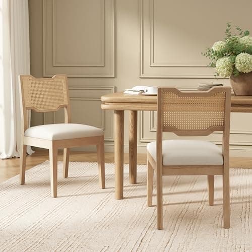 A dining table and chairs in a warm interior