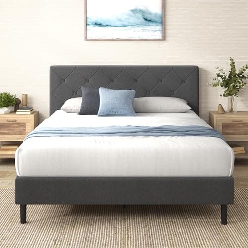 A made bed with layered linens in a cozy bedroom